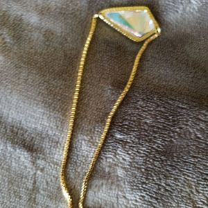 Gold bracelet with iridescent charm